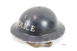 A WWII era Home Service helmet, police marking, co