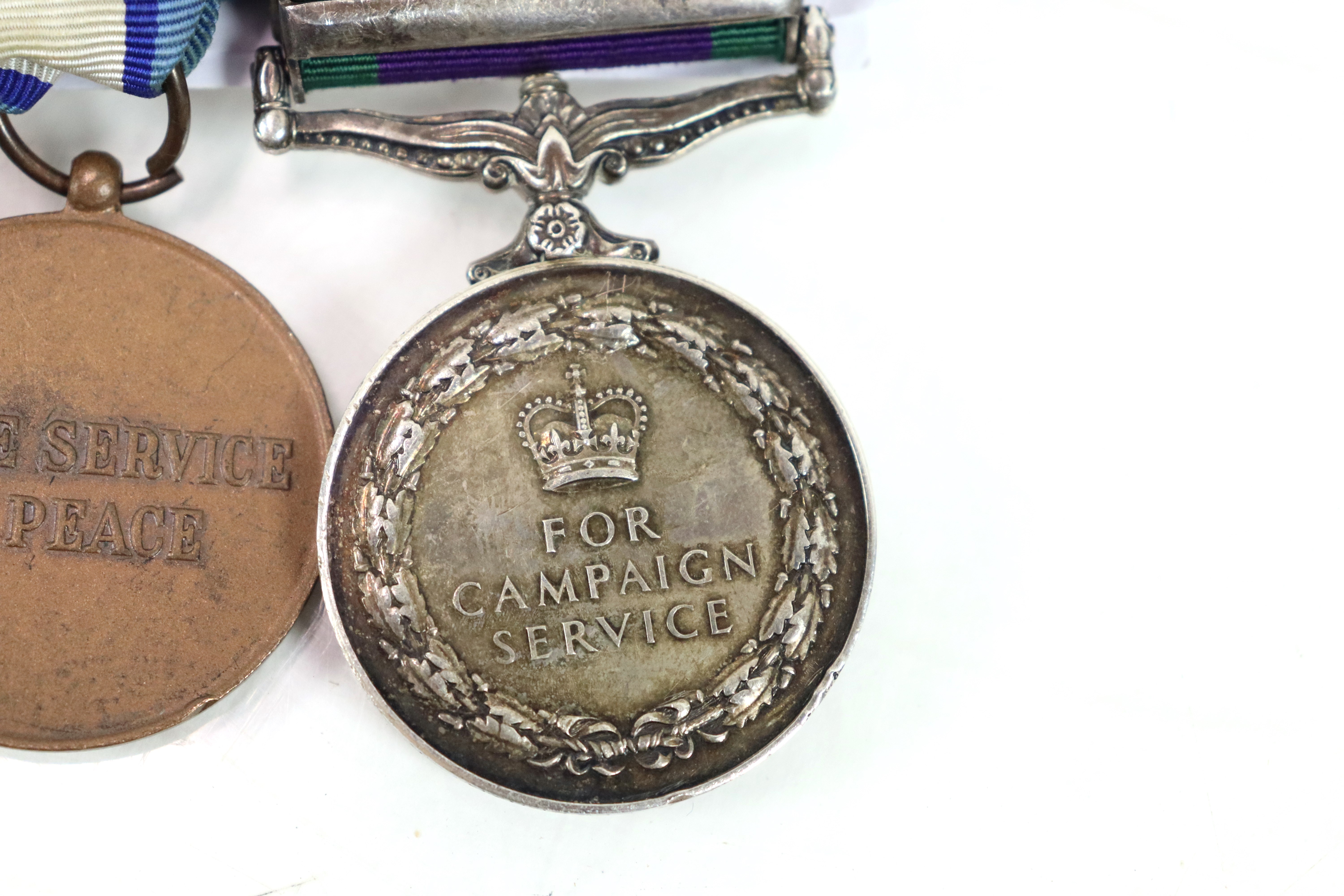 A Royal Anglian Regiment group of three medals, E. - Image 7 of 7