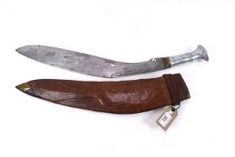 A large Kukri with white metal grip, blade approx.