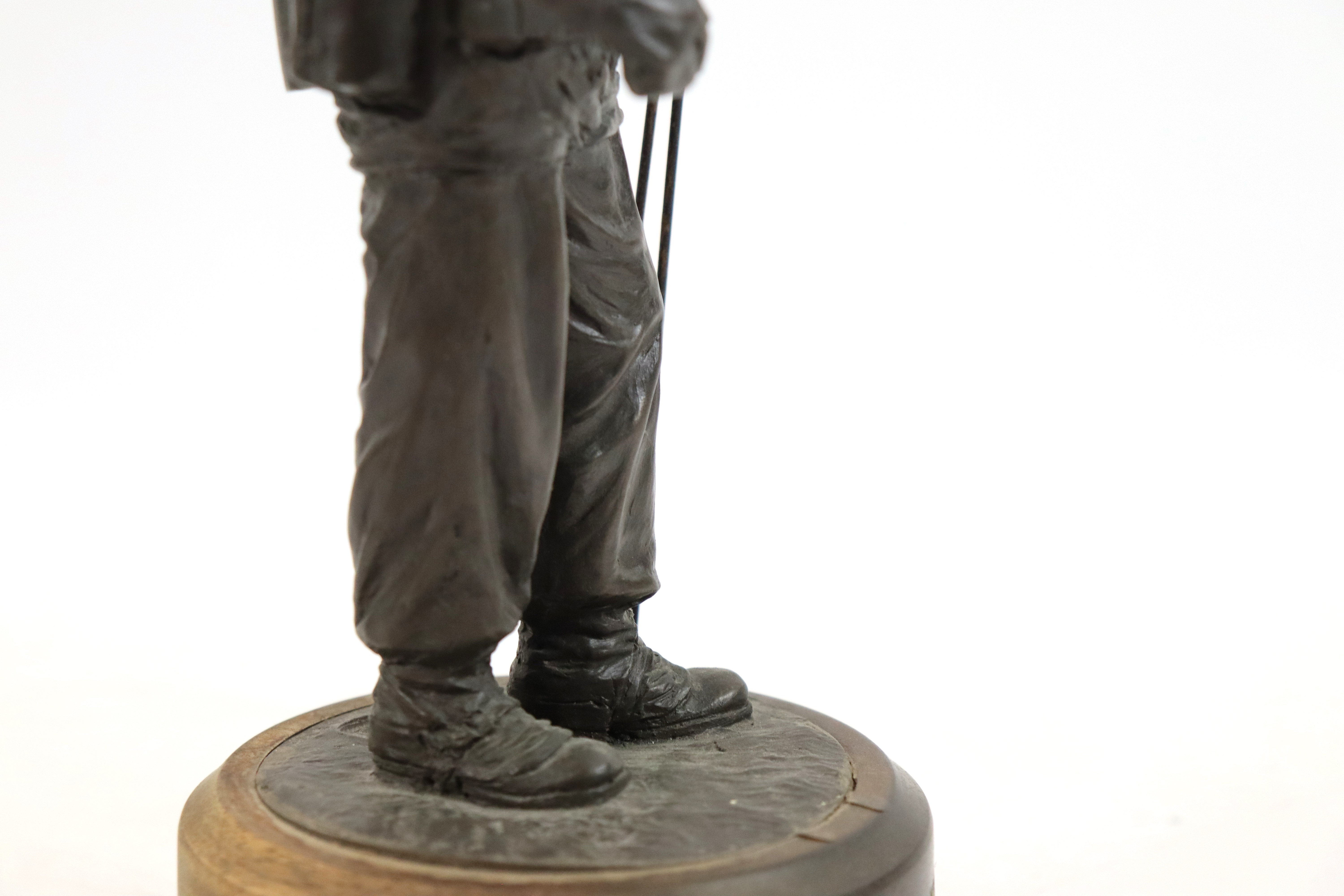 A bronzed resin figure of a soldier with his S.L.R. - Image 13 of 16