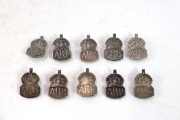 Ten silver A.R.P. lapel badges