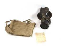 A Siebe Gorman gas mask (SG & Co. Ltd 1938) within