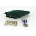 A Royal Marine beret with badge; a Royal Marine b