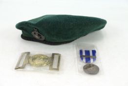 A Royal Marine beret with badge; a Royal Marine b