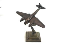 A British "Mosquito" model plane in cast brass mou