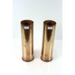 A pair of 105mm M14 shell cases, one with "Free Fr