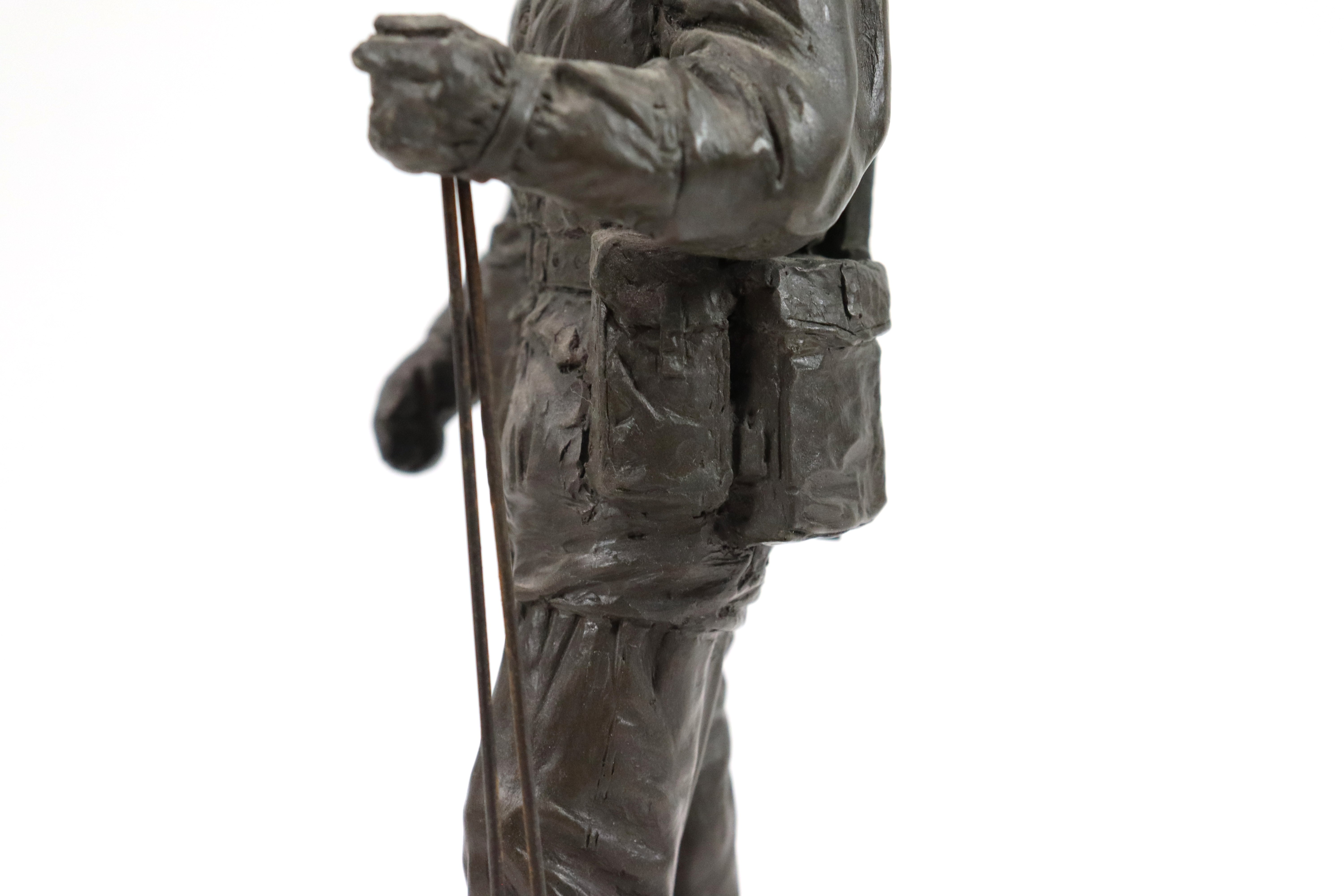 A bronzed resin figure of a soldier with his S.L.R. - Image 8 of 16