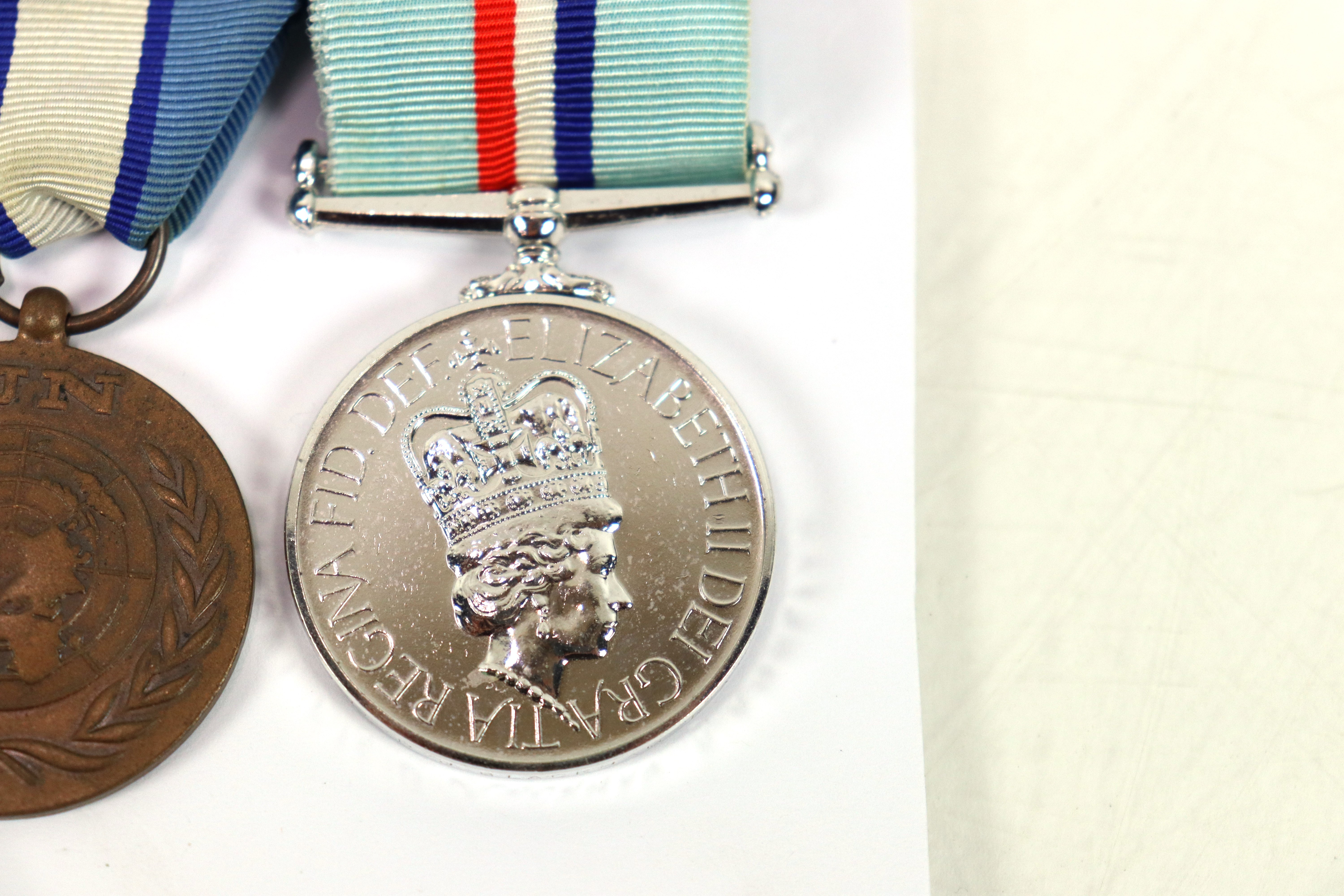 A Royal Anglian Regiment group of three medals, E. - Image 4 of 7