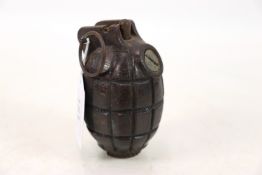 An inert WWI No.36 MkI grenade, marked base plug,