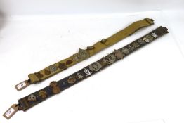 Two 37 patt belts displaying a collection of milit