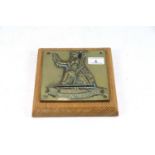 A cast brass "The Royal Norfolk Regiment" plaque m