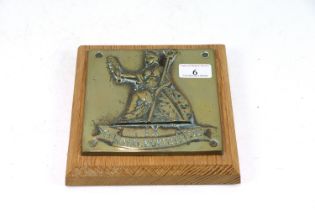 A cast brass "The Royal Norfolk Regiment" plaque m
