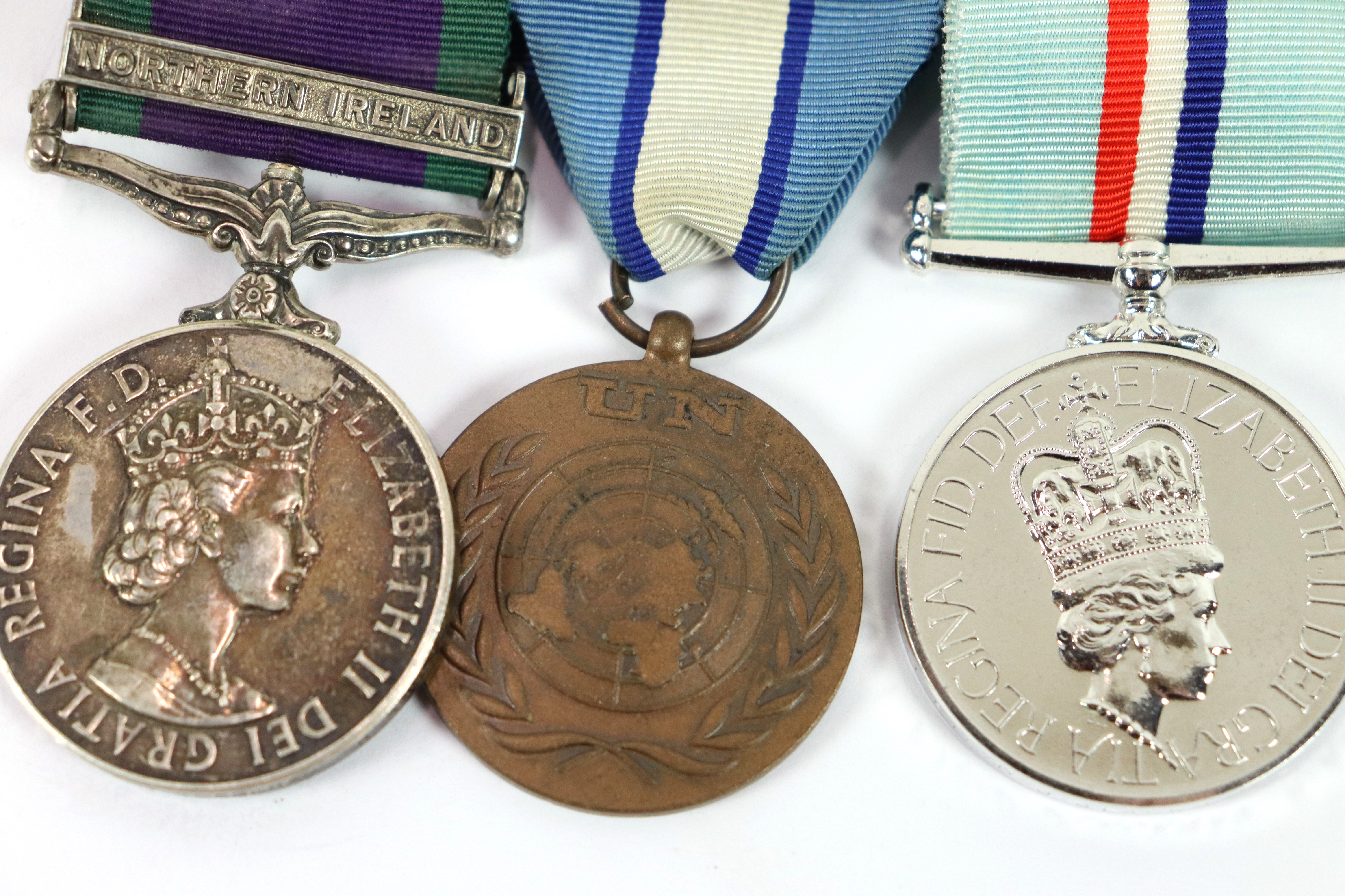 A Royal Anglian Regiment group of three medals, E. - Image 3 of 7