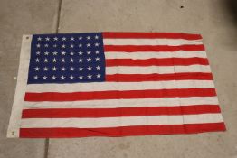 A U.S.A. flag marked U.S.N. and 1941