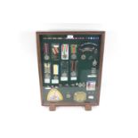 A table top display case with contents including T