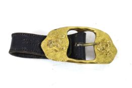 A leather hanging strap with high quality gilded b