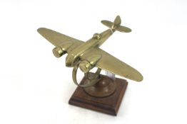 A brass Blenheim MkIV model on sprung support and