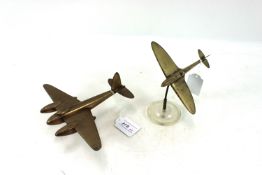 A brass model Spitfire with a mosquito