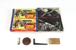 A mixed lot including two boxed toy cap guns and a