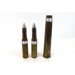 Two 30mm shell cases with heads, and a 40mm Bofers