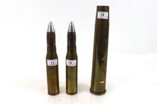 Two 30mm shell cases with heads, and a 40mm Bofers