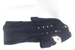 A German WWII era woman's Red Cross coat with armb