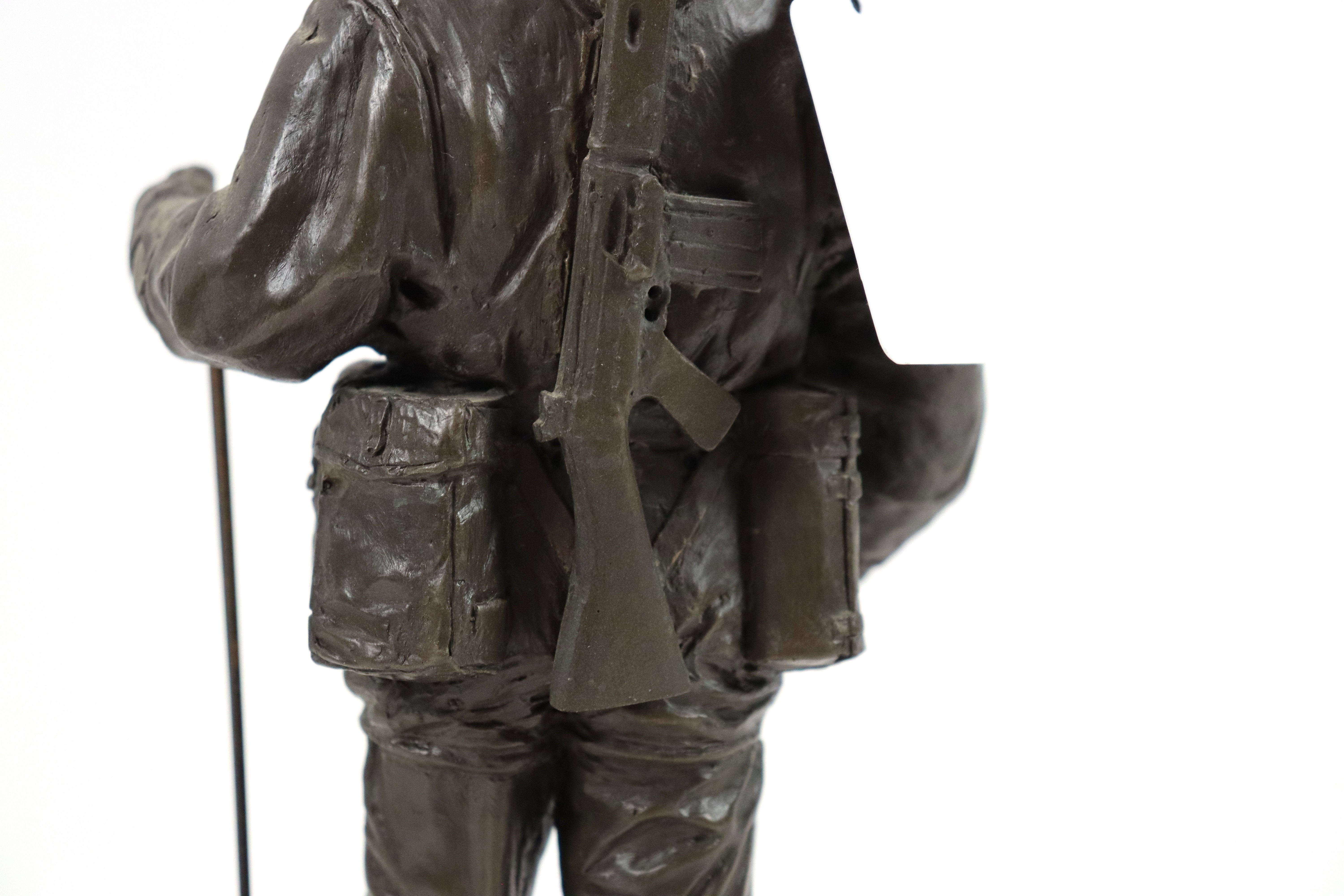 A bronzed resin figure of a soldier with his S.L.R. - Image 11 of 16