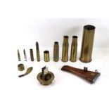 A collection of various shell cases including WWI