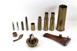 A collection of various shell cases including WWI