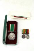 A W.V.S. medal (cased) with WWII Defence miniature