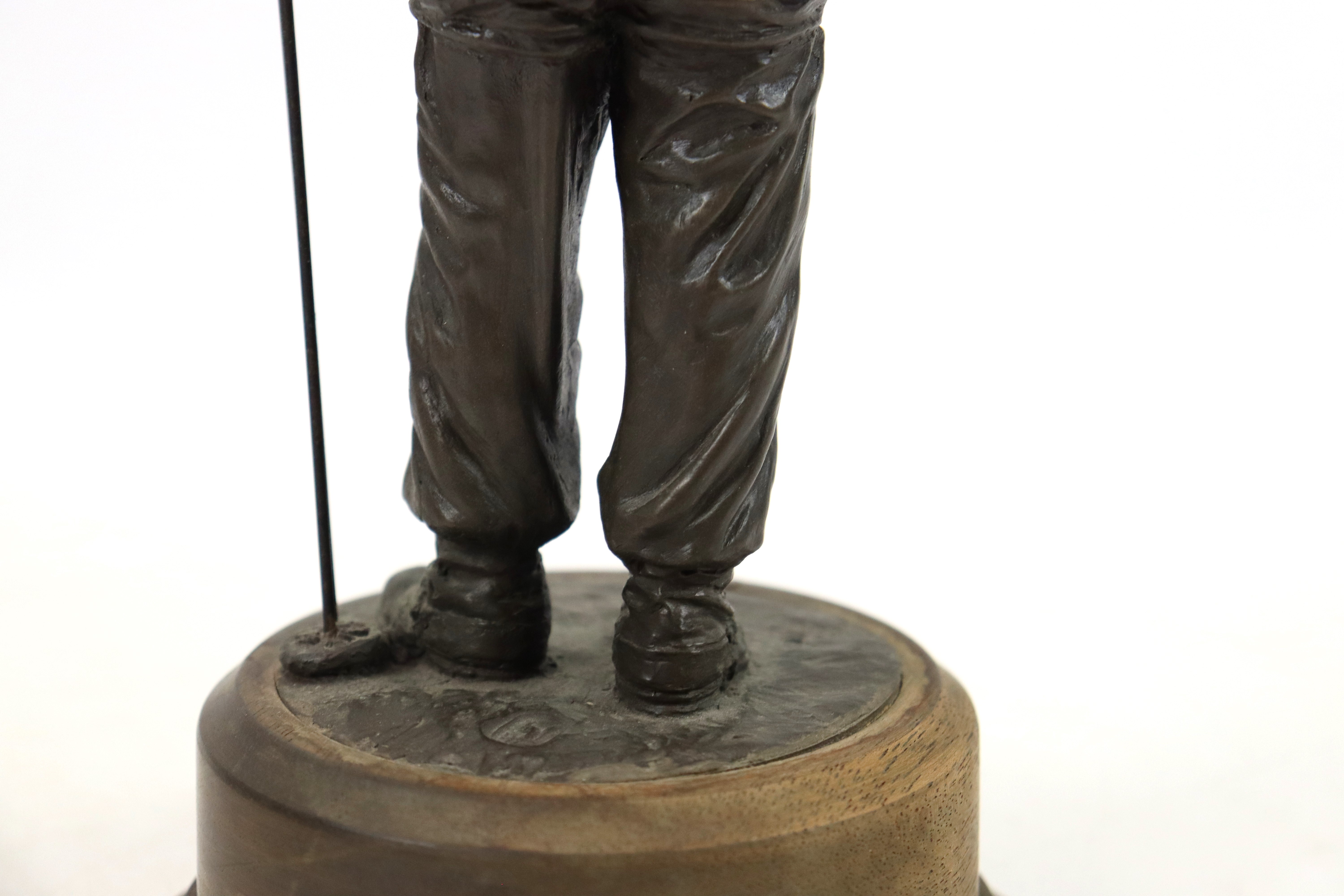A bronzed resin figure of a soldier with his S.L.R. - Image 10 of 16