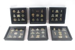 Six displays of various military badges , all fram