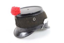 An early 20th Century Swiss felt and leather Shako