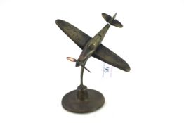 A model of a U.S.A. Airacobra fighter on brass rou