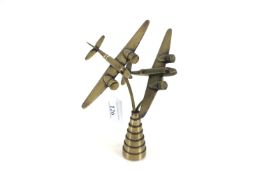 Two brass model Beau fighters mounted on steeped b