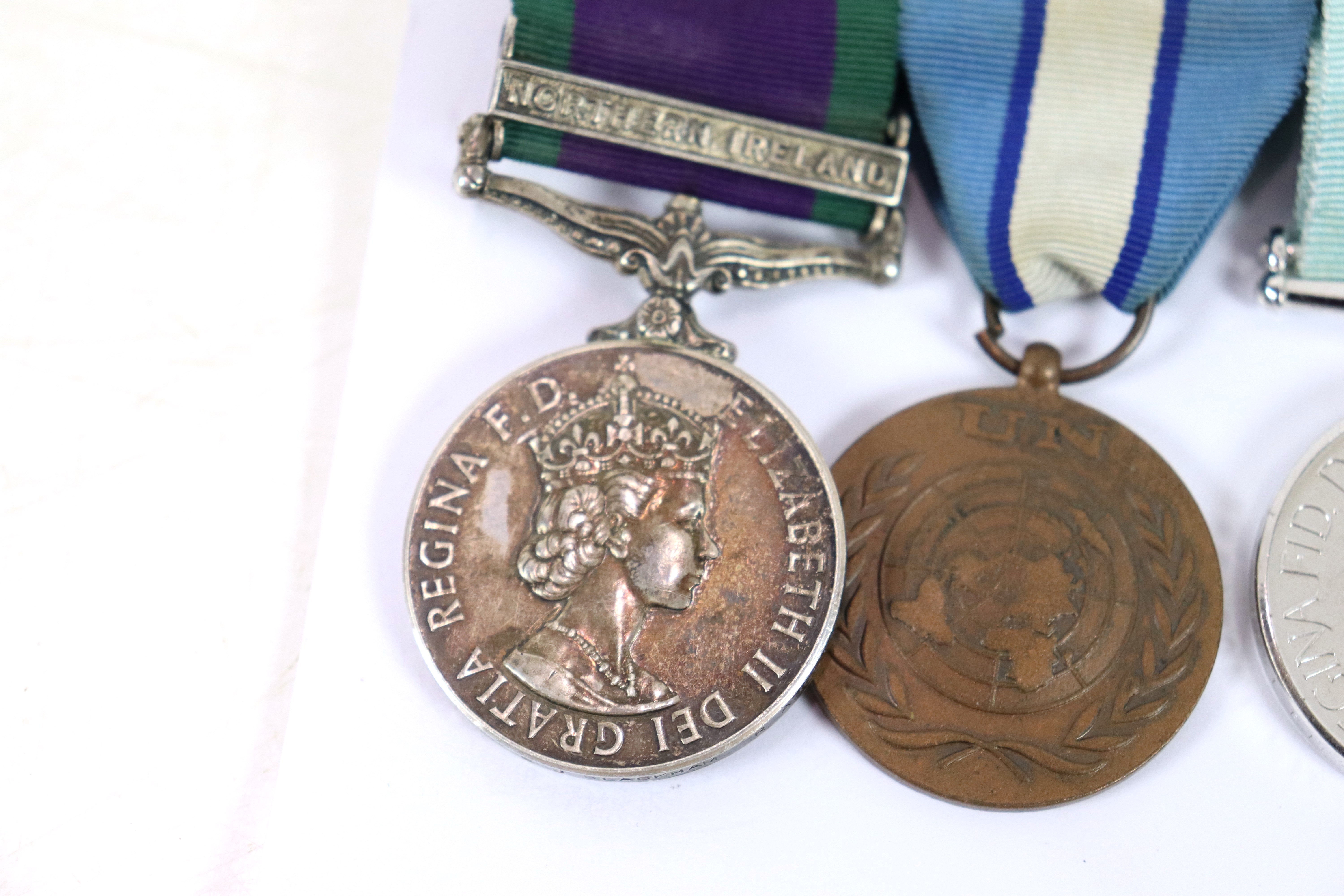 A Royal Anglian Regiment group of three medals, E. - Image 2 of 7