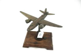 A model of a Wimpy bomber in cast brass mounted on