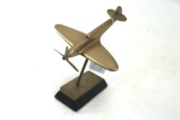 A Spitfire model on brass and wooden base, a good s