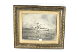 A photograph of H.M.S. Resolution, framed and glaz