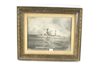 A photograph of H.M.S. Resolution, framed and glaz