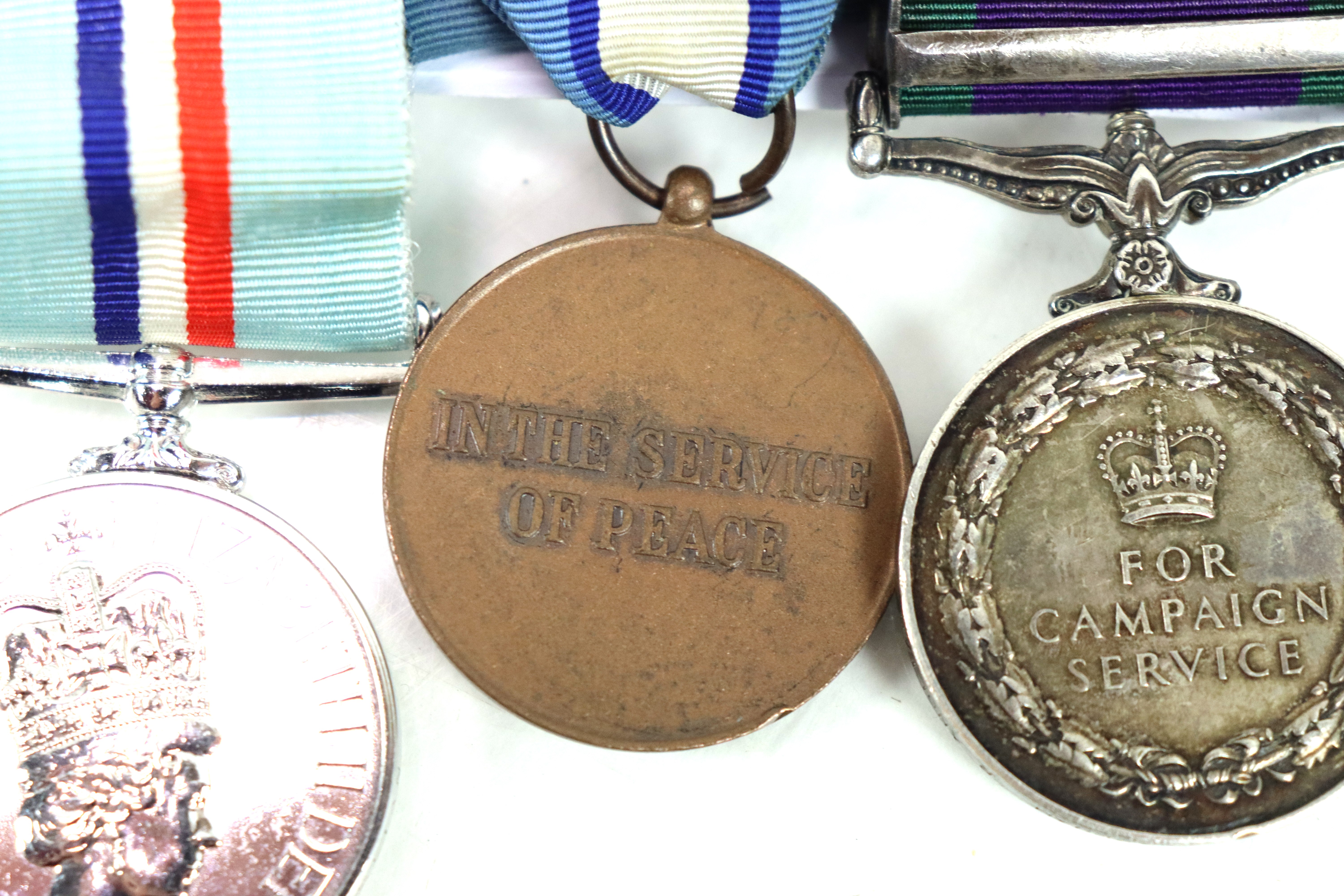A Royal Anglian Regiment group of three medals, E. - Image 6 of 7