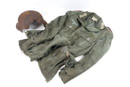 A German WWII service jacket and helmet reputedly