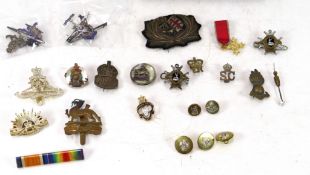A collection of military badges, insignia and broo