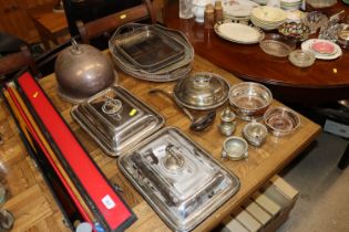 A pair of plated entreé dishes; two plated tea tra