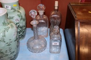 Four glass decanters (one lacking stopper)