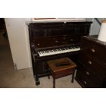 A Bluthner Leipzig upright piano No. 63461; and a mahogany upholstered piano stool
