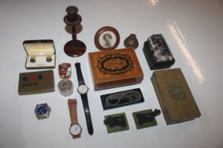 A box containing various small sundry items includ