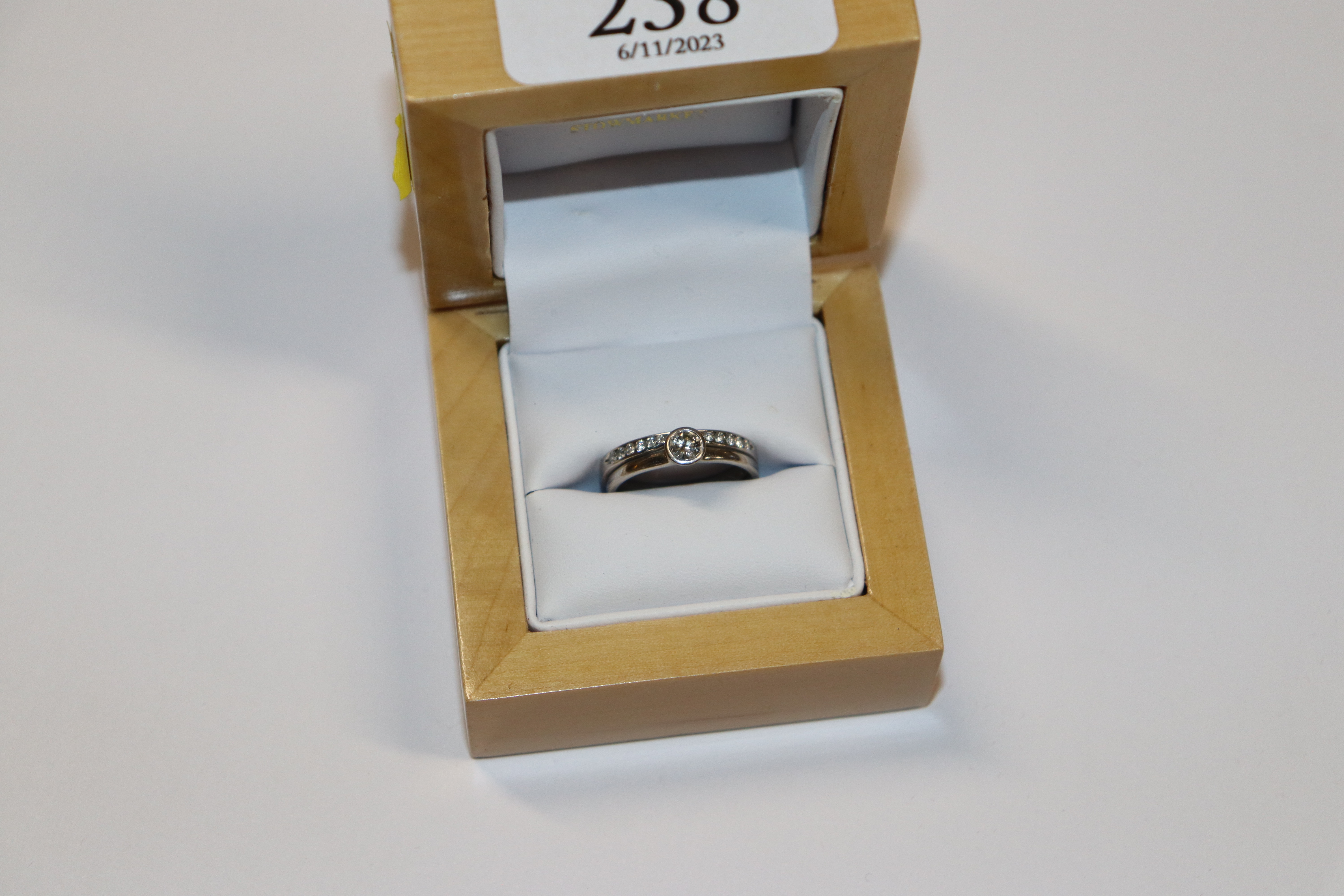 An 18ct white gold combined wedding ring and engag
