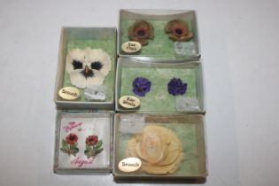 Two hand painted floral brooches and two pairs of