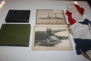 A box containing WWII manuals on seamanship, flags